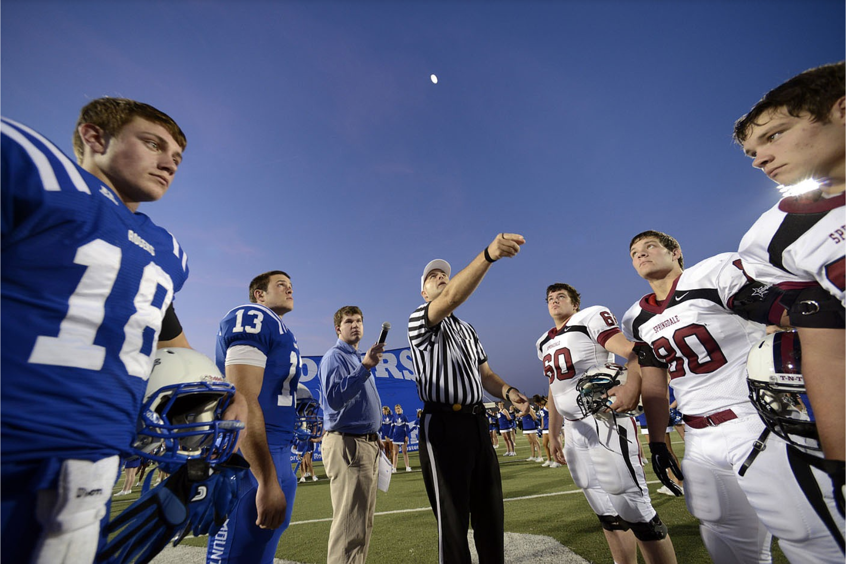 Football officials huddle